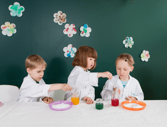 young children performing a science experiment